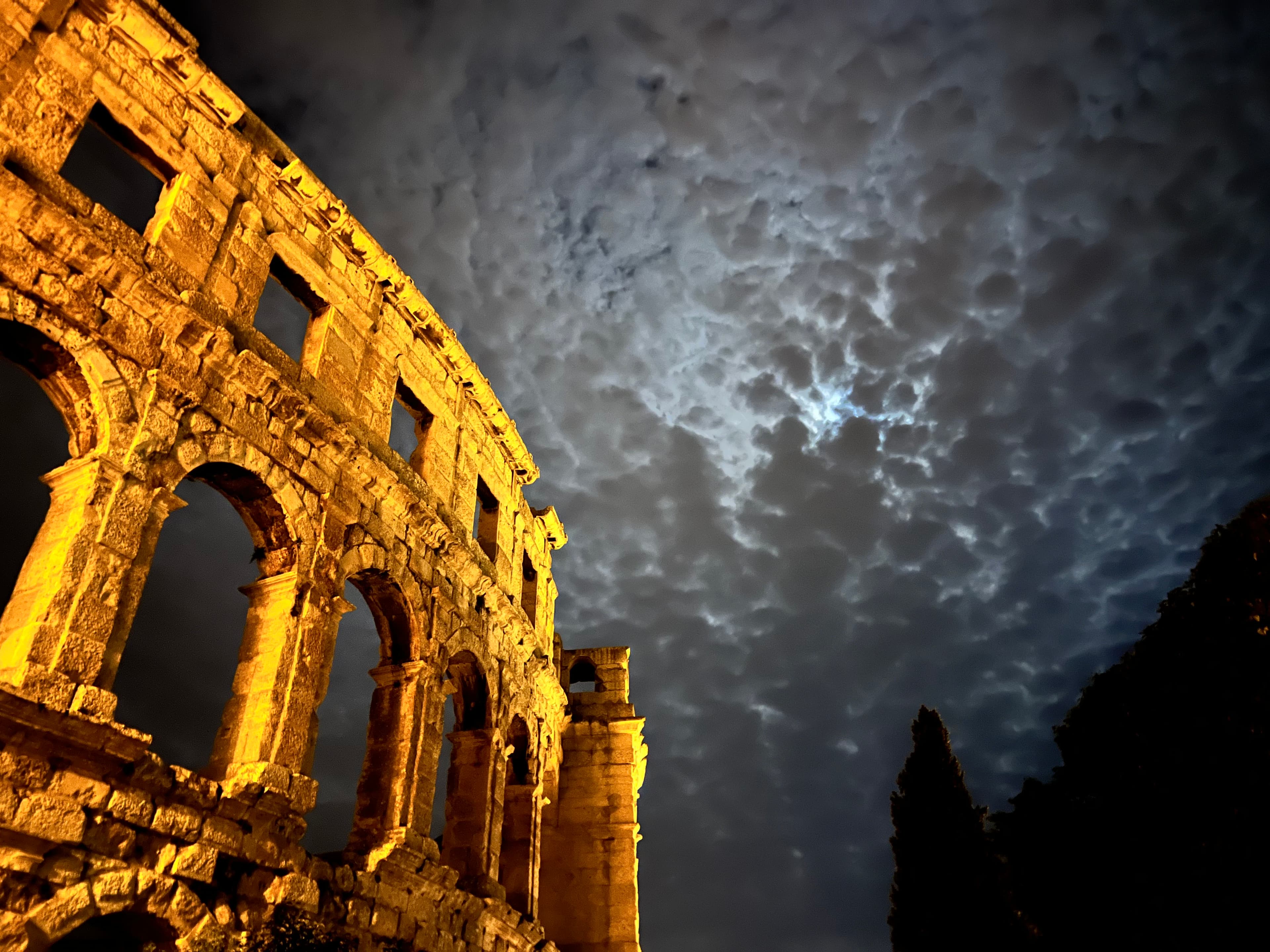 The Pula Arena lit up at night